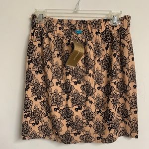 Nude Skirt with All Over Black Flower Designs